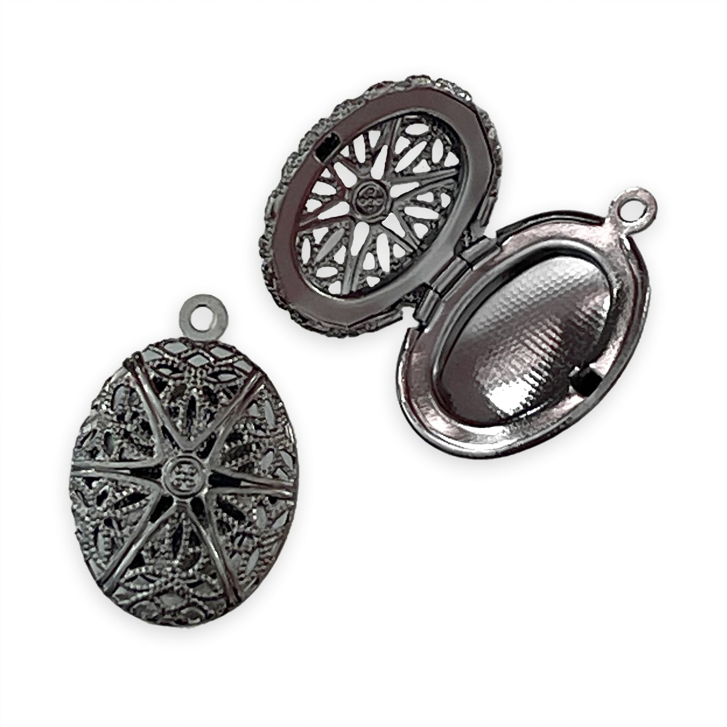 2 x Oval lockets with cut-out lace detail, gun metal colour