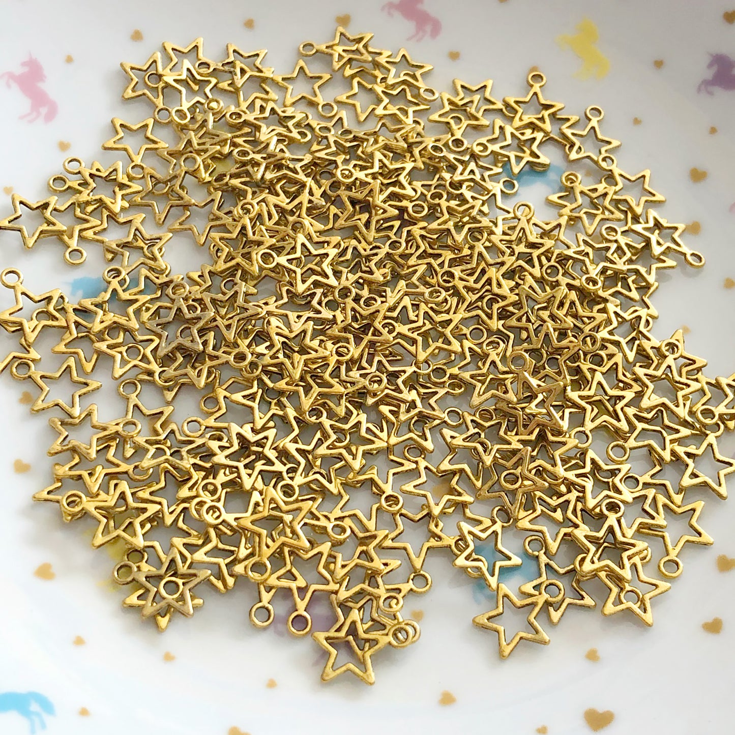 20 mini hollow star charms, antique gold colour