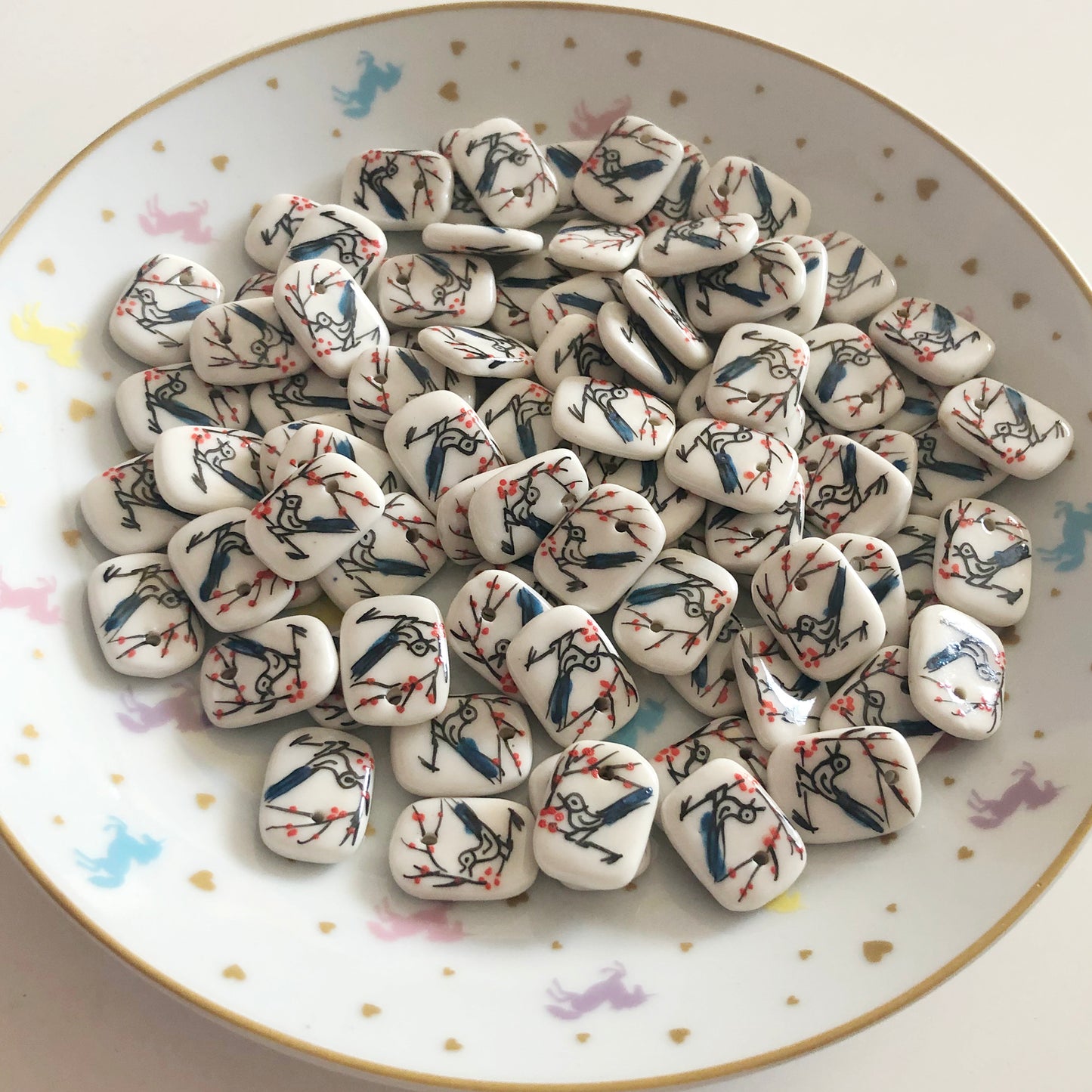 4 porcelain bird and blossom tile charms