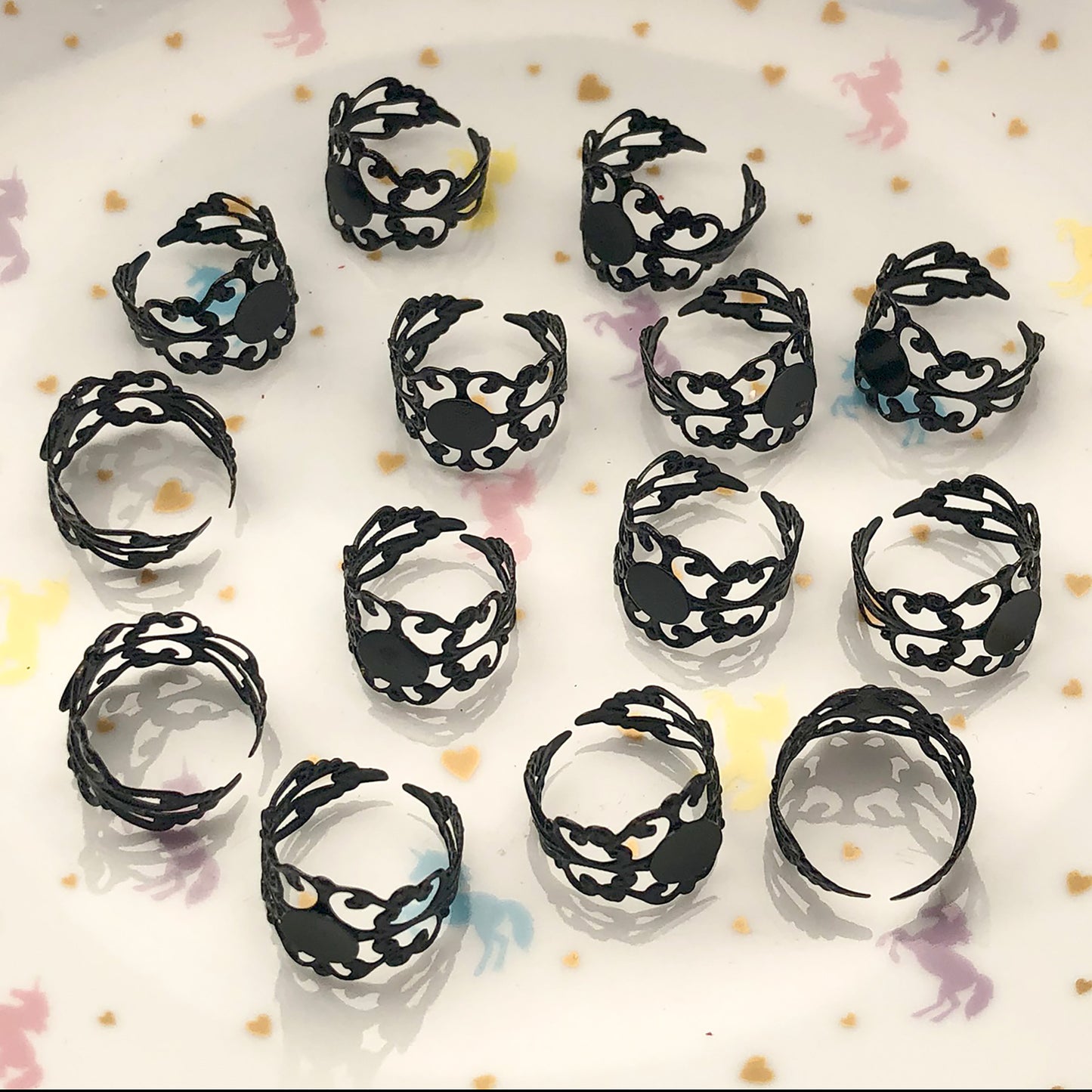 4 black filigree ring settings