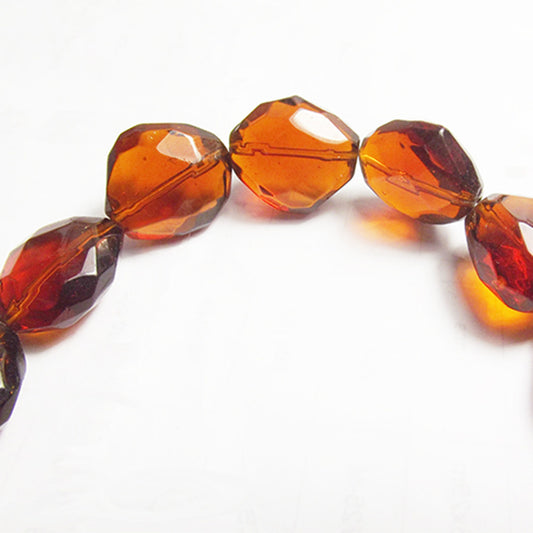 Brown oval faceted string of glass beads