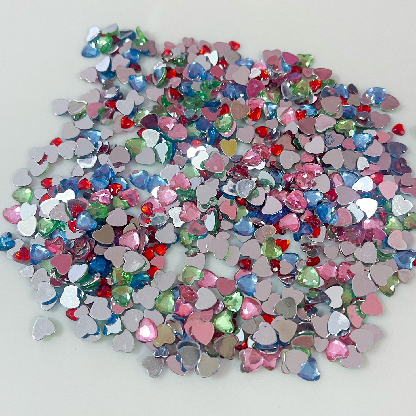 Bag of resin heart cabochons, mixed size and colours