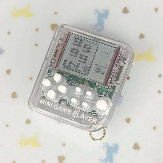 Transparent 90s electronic games charm with working games!