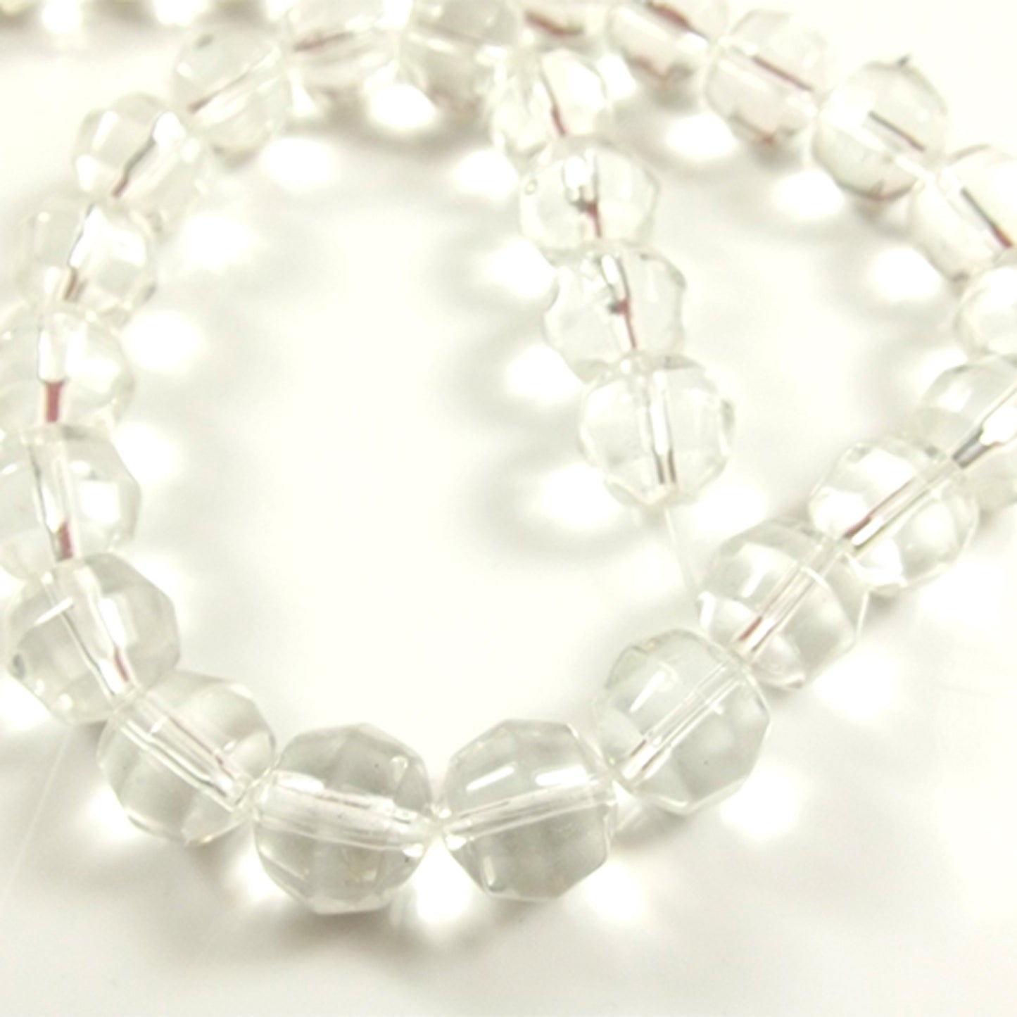 Clear round faceted string of glass beads