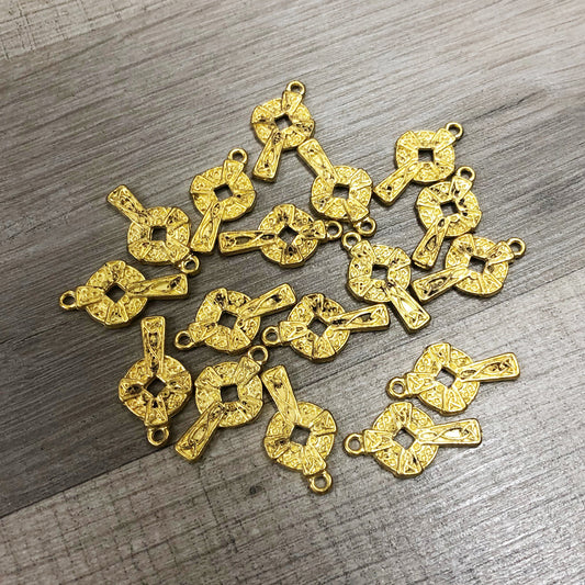 Cross charms in gold colour, B grade