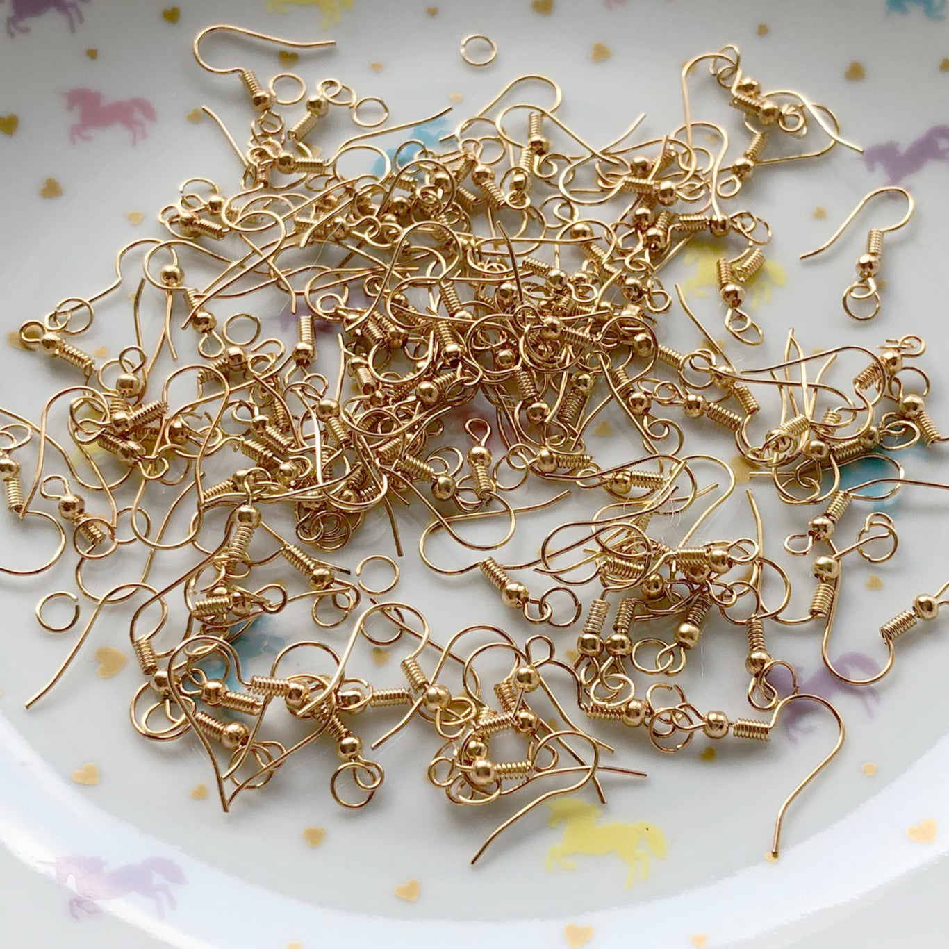 15 pairs of gold colour earring hooks