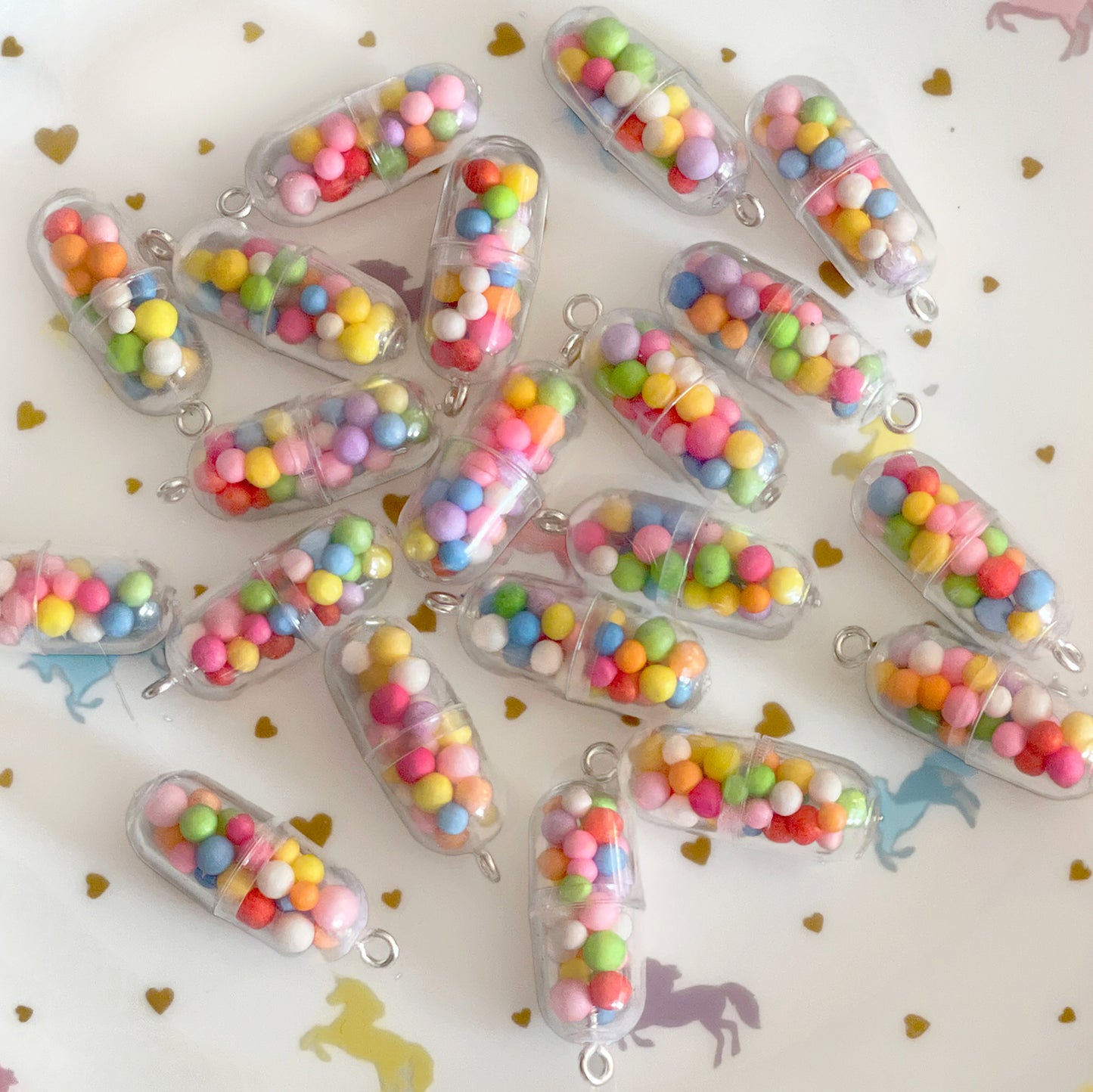 4 x Happy pill rainbow charms