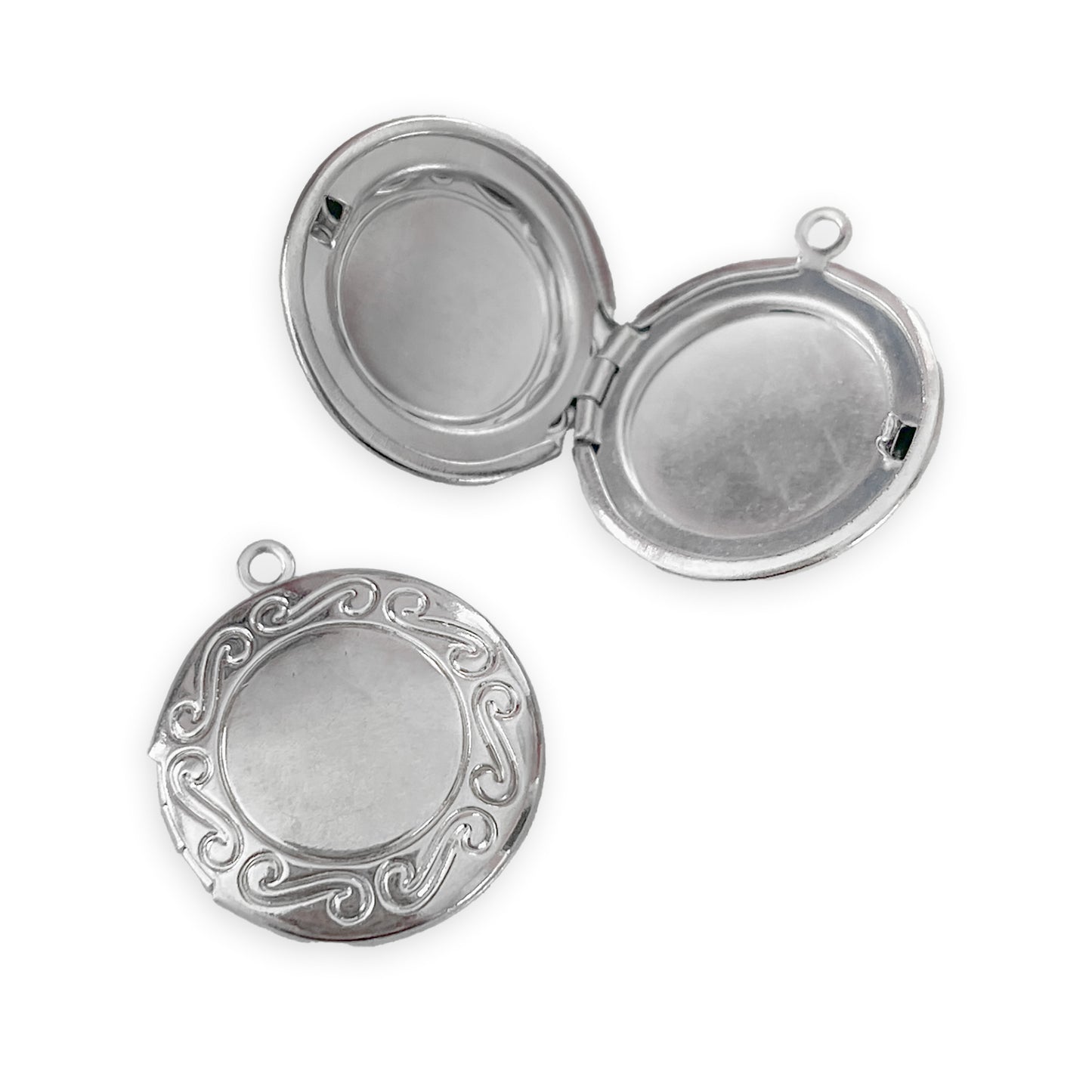 2 x Round S-swirl embossed lockets, silver colour