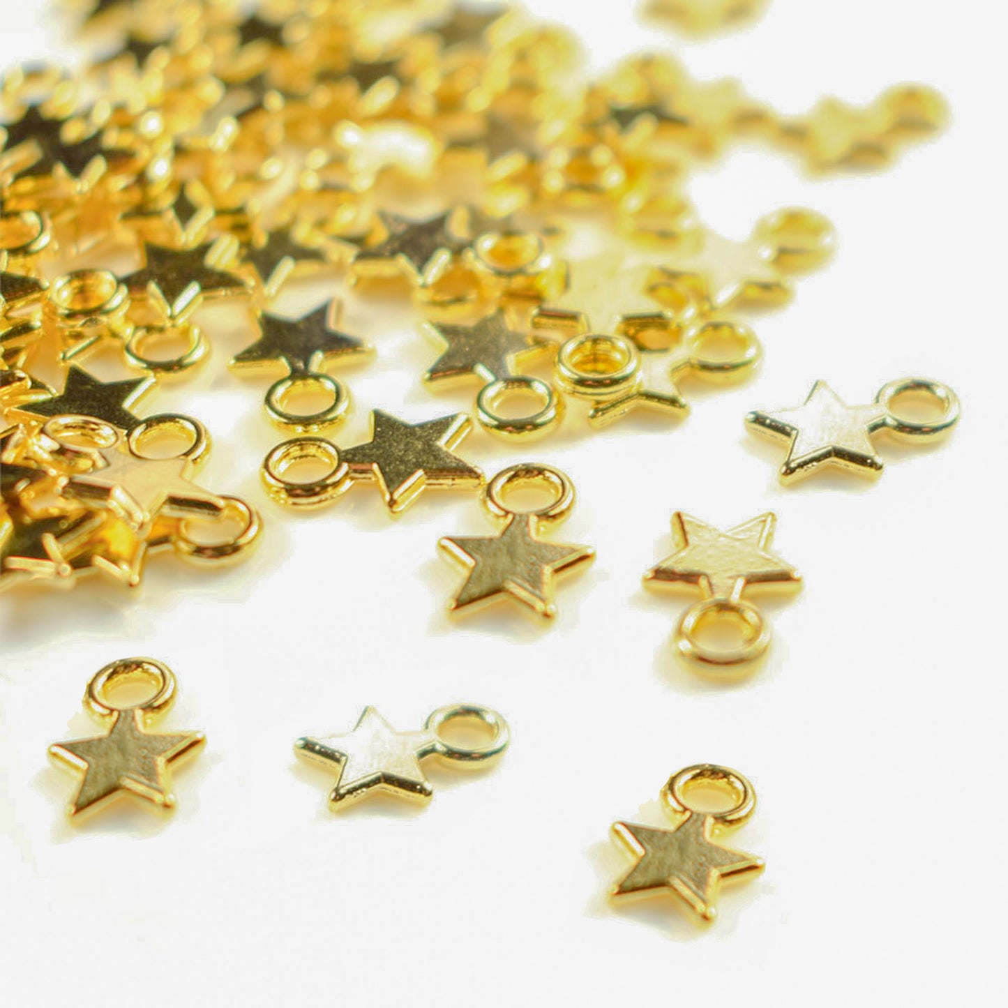 20 shiny gold colour mini star charms