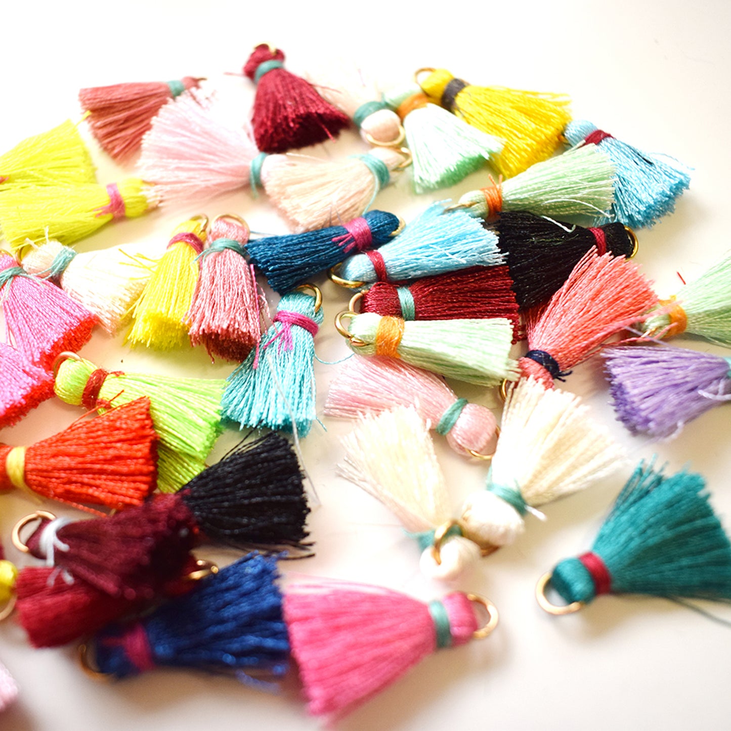 10 x Mini tassel charms with gold colour loop