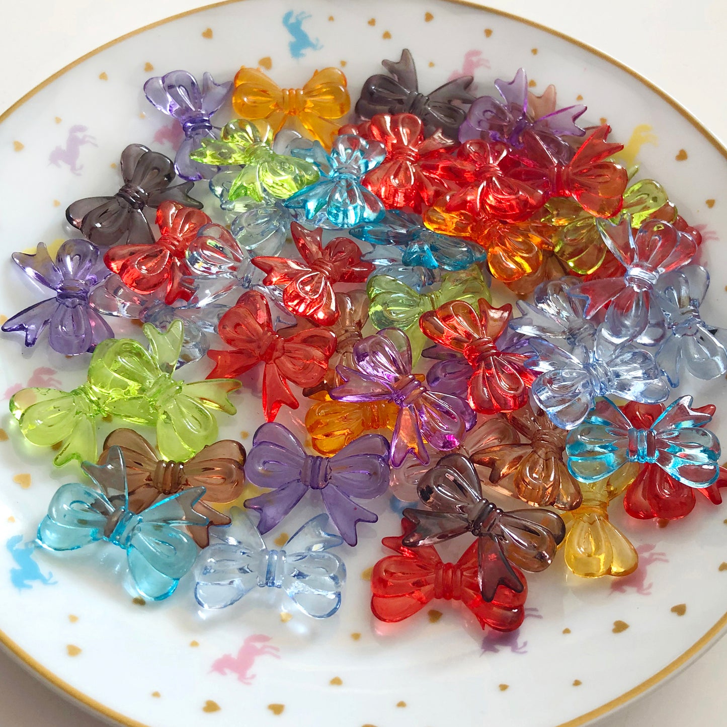 10 transparent bow beads